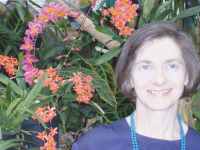 Woman with background orchid display