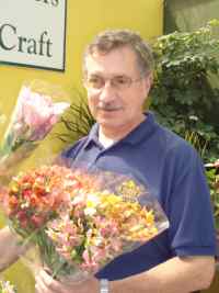 Man holding alstromerias